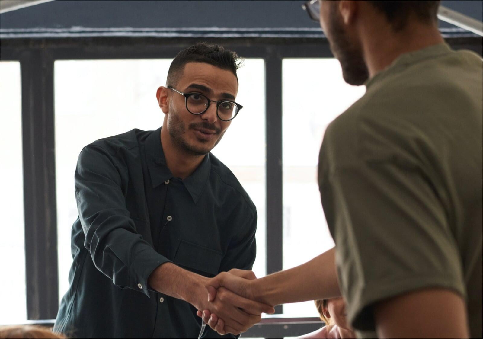 man shakes hand of case manager